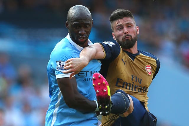 Mangala tussles with Arsenal's Olivier Giroud during a Premier League match last season