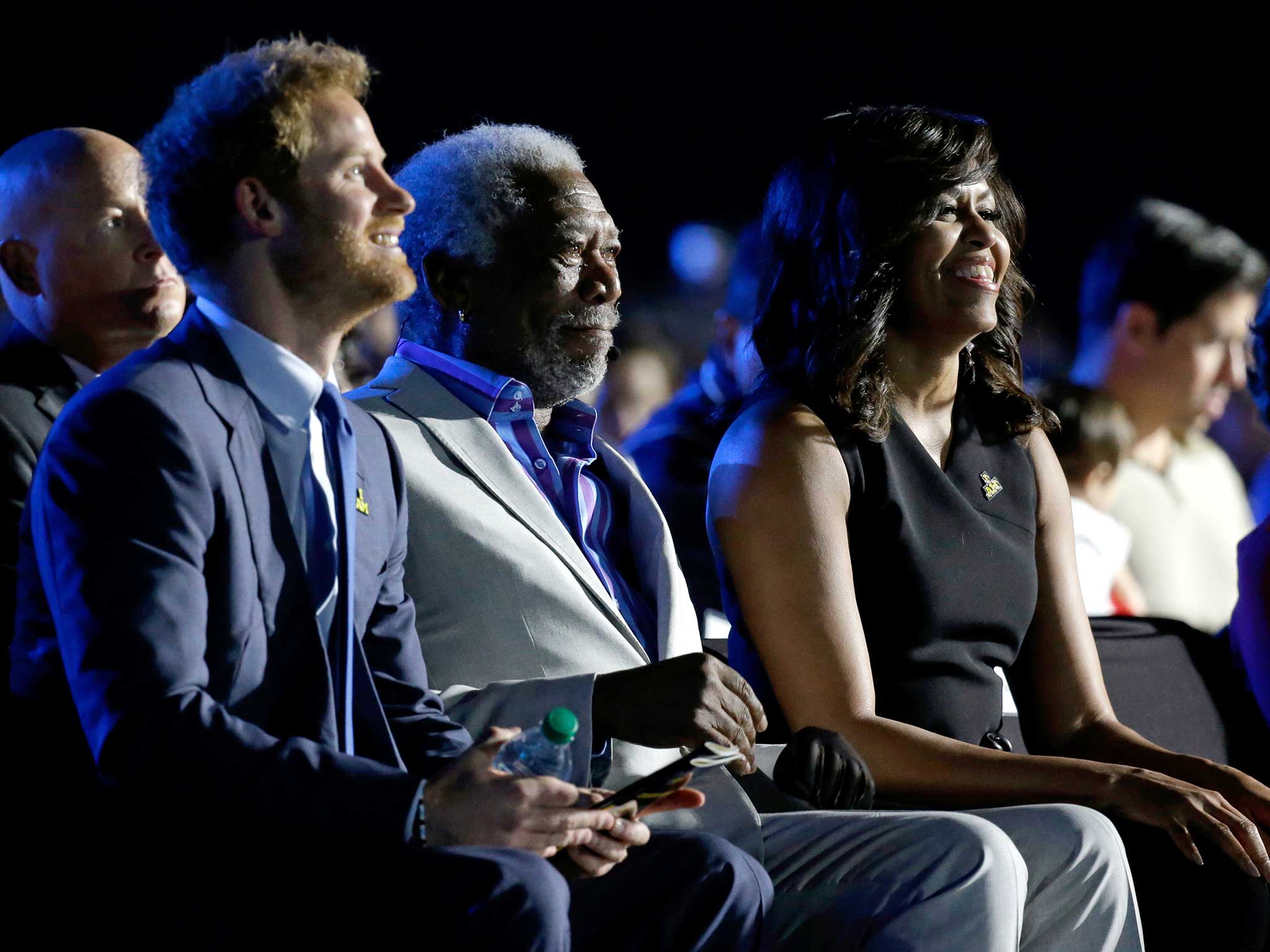 Britain's Prince Harry, actor Morgan Freeman and first lady Michelle Obama listen to speakers during the opening ceremony for the Invictus Games