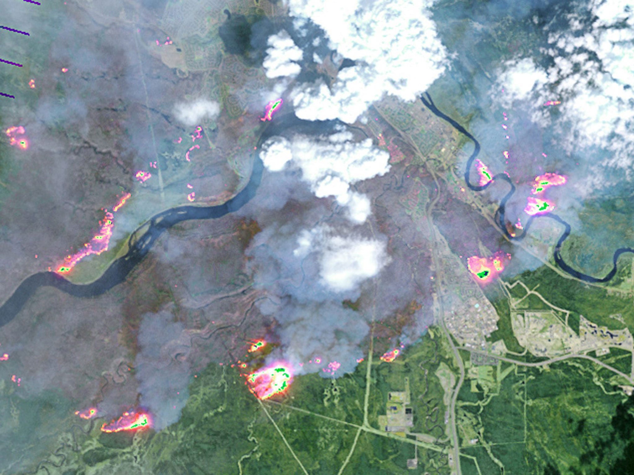 A satellite image shows the scale of the wildfire which burned through parts of Alberta, Canada