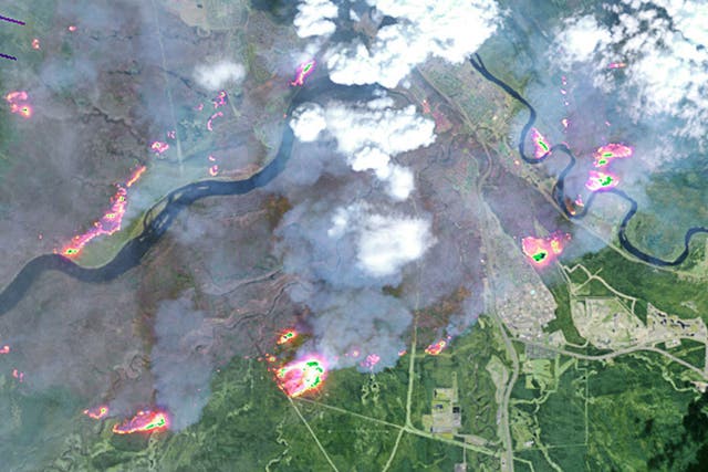 A satellite image shows the scale of the wildfire which burned through parts of Alberta, Canada