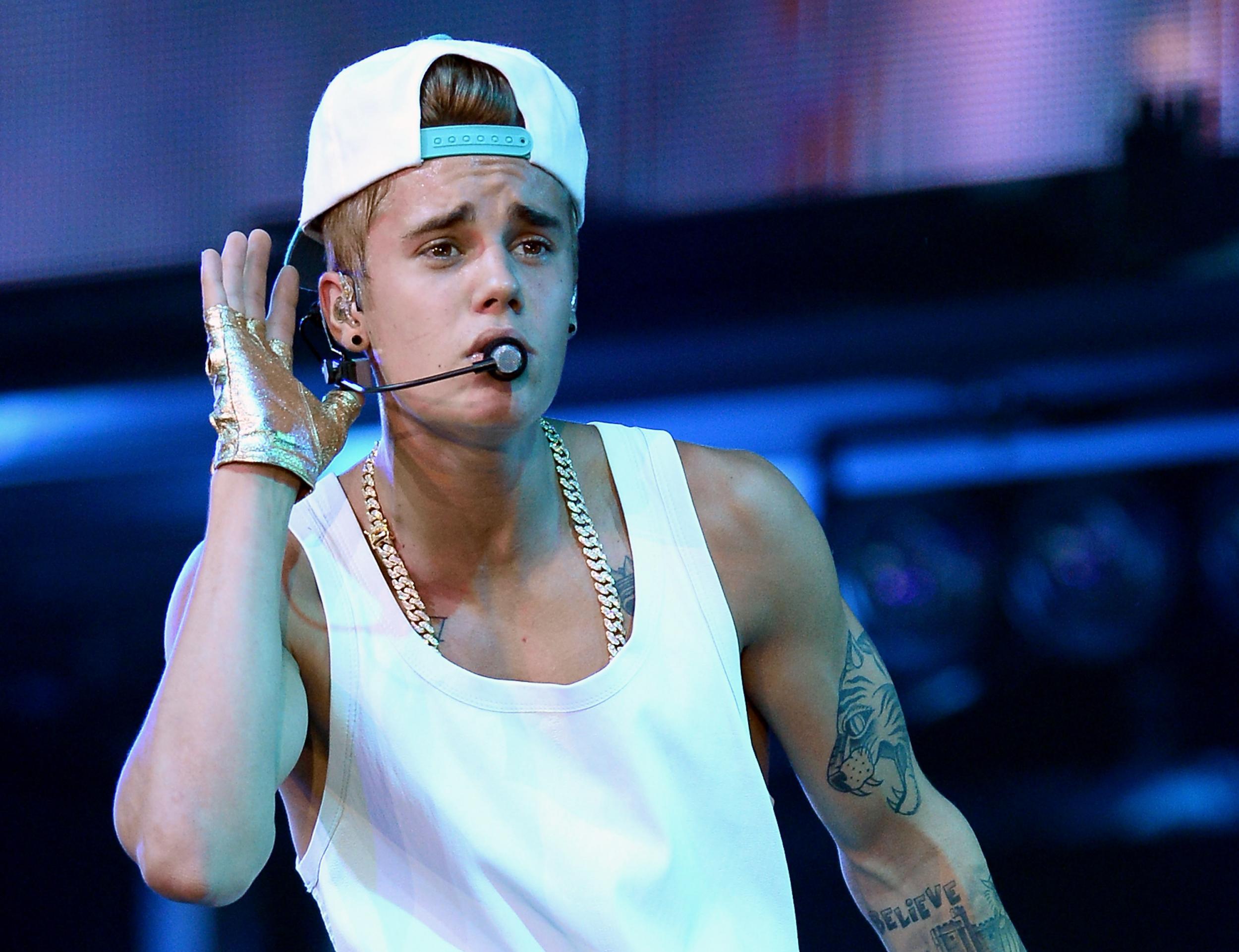 Justin Bieber is clearly enjoying himself on stage between backflips