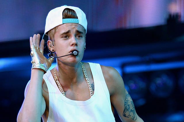 Justin Bieber is clearly enjoying himself on stage between backflips 