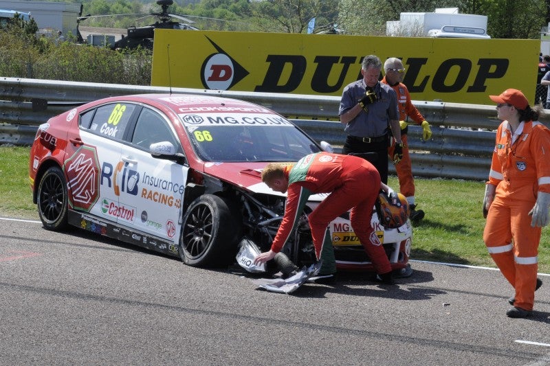 &#13;
Josh Cook inspects the damage to his MG after hitting Matt Neil &#13;