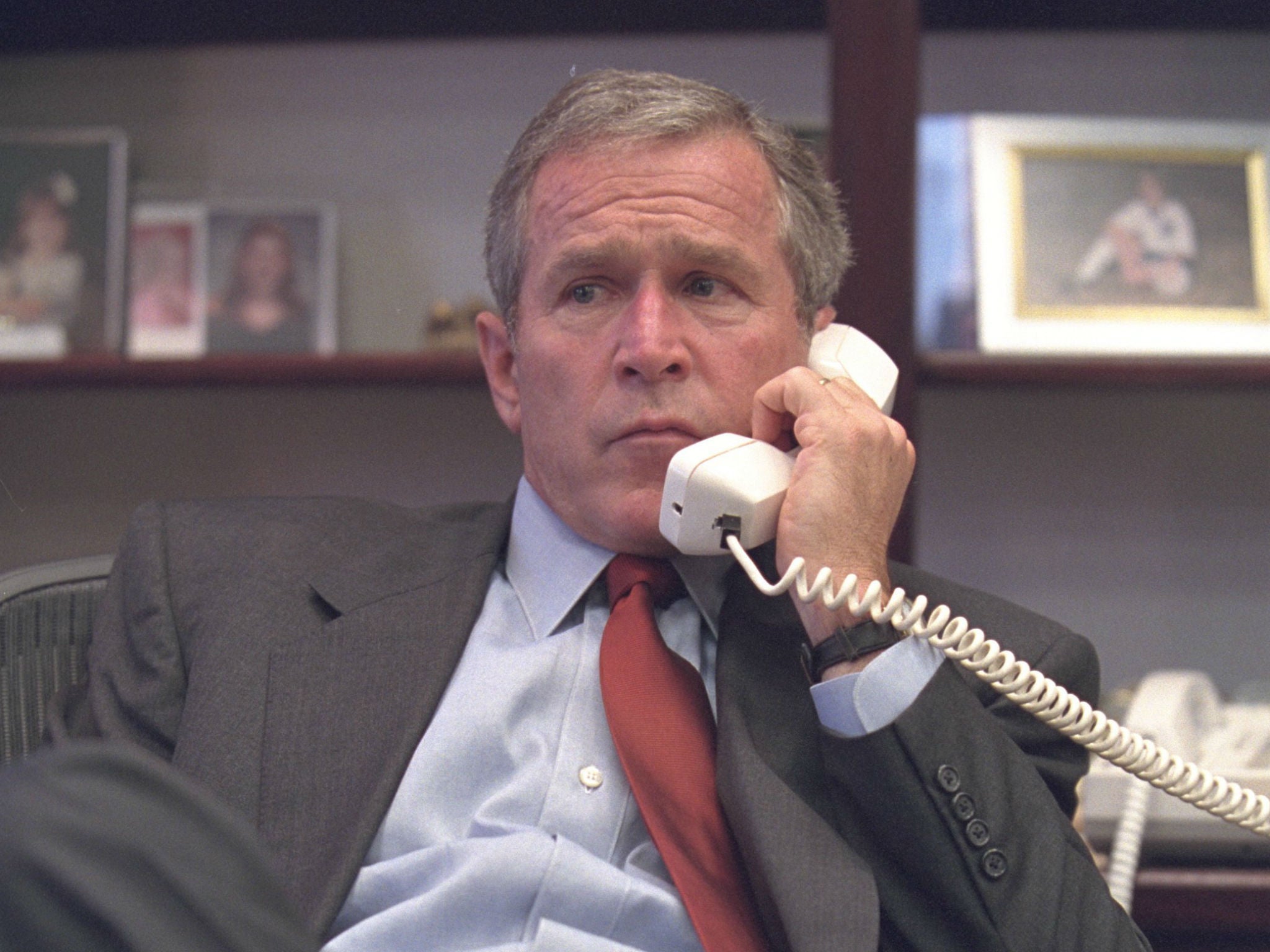 The former president takes a call at the Barksdale Air Force Base