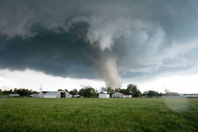 A tornado rips through a residential area after touching down south of Wynnewood, Oklahoma in the US