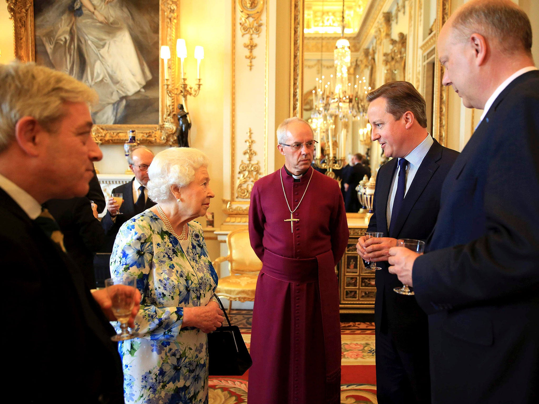 The Queen speaks to David Cameron during a reception in Buckingham Palace, as Chris Grayling (R), leader of the House of Commons John Bercow (L) and Archbishop of Canterbury Justin Welby (C) look on