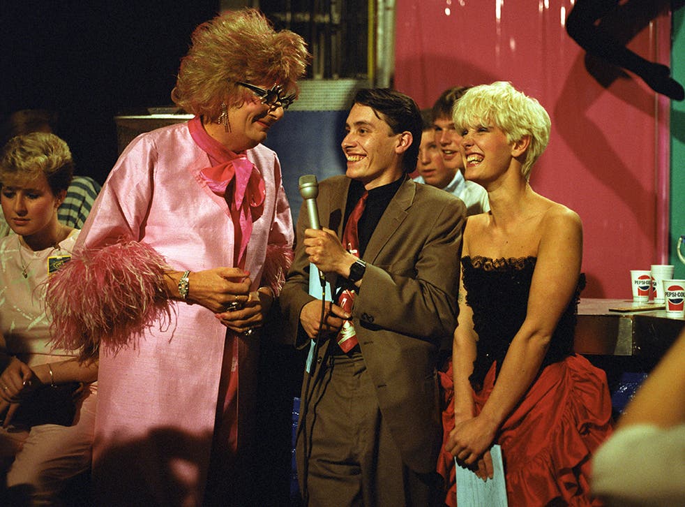 Barry Humphries as Dame Edna Everage, along with Jools Holland and Paula Yates on 'The Tube'
