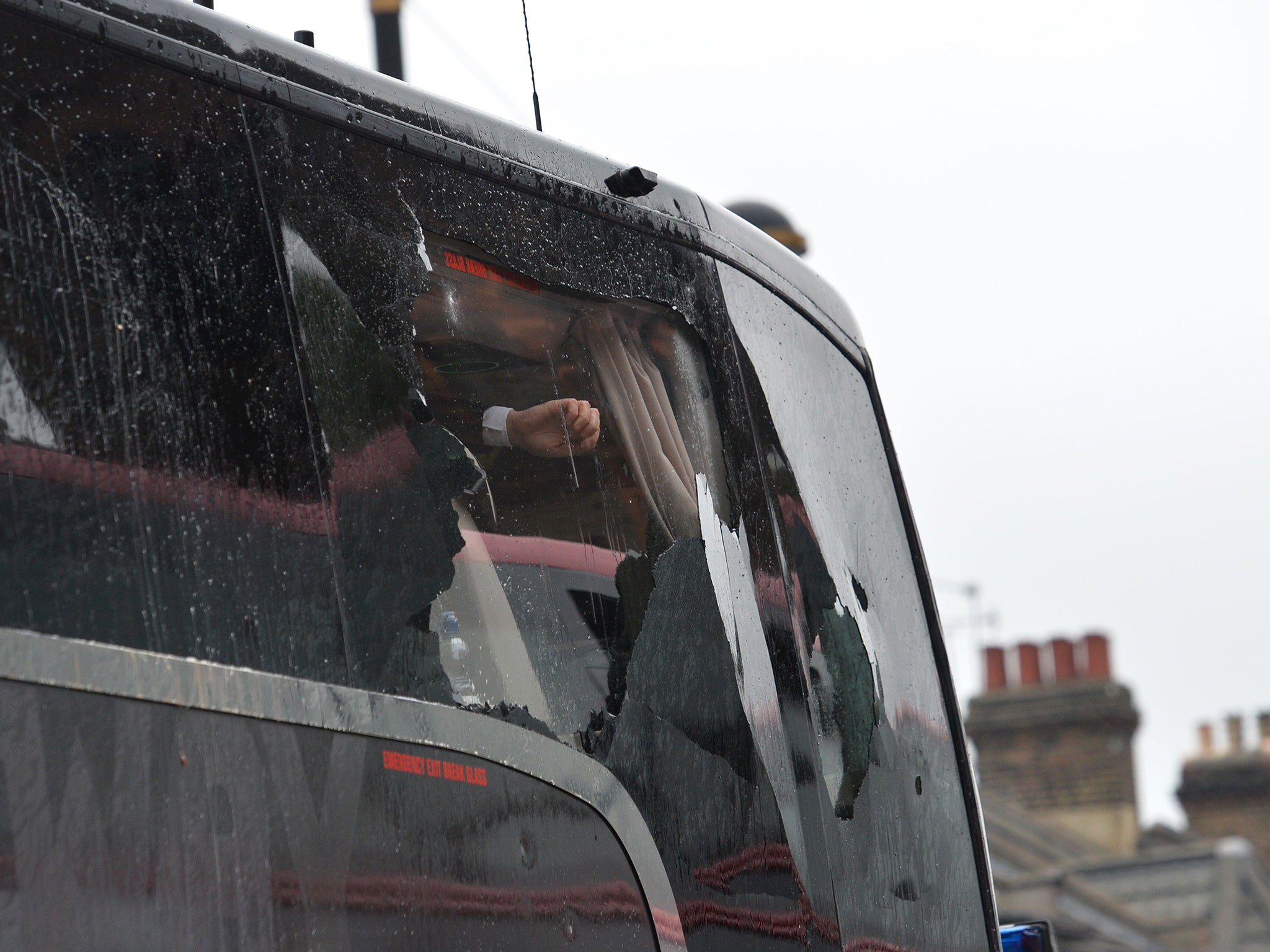 A window of United's coach showing the damage