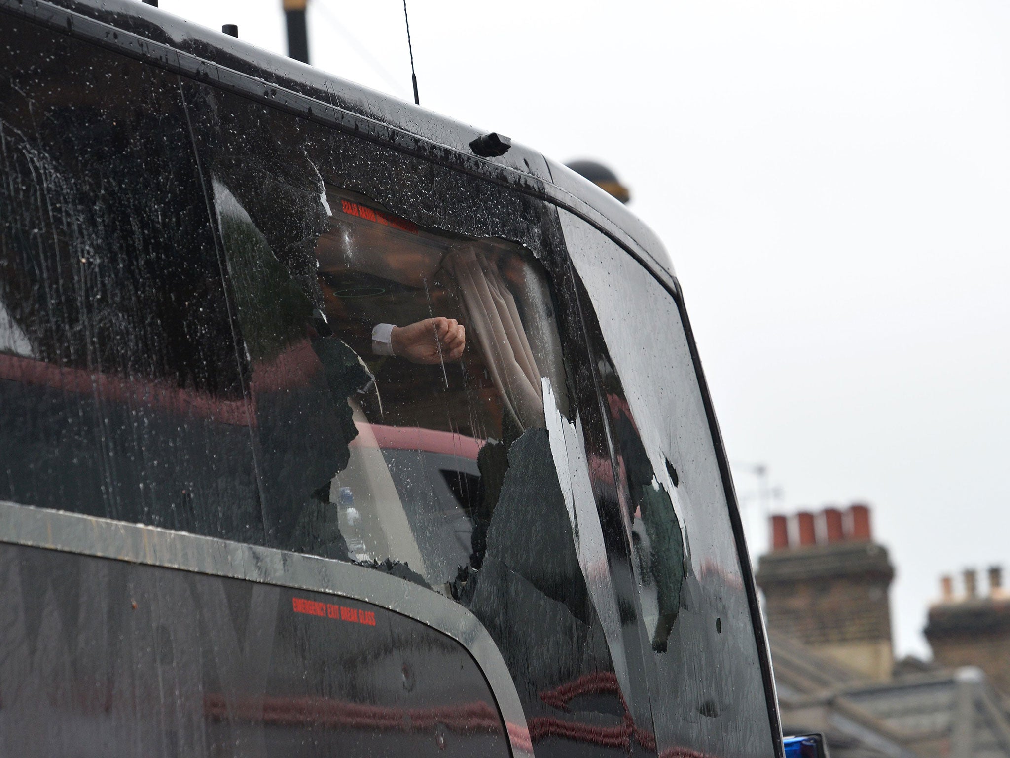 The bus carrying the Manchester United team after having a window smashed on its way to play West Ham in the last match to be held at the Boleyn Ground (AFP/Getty Images)