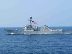 China scrambles fighter jets as US warship sails near disputed islands