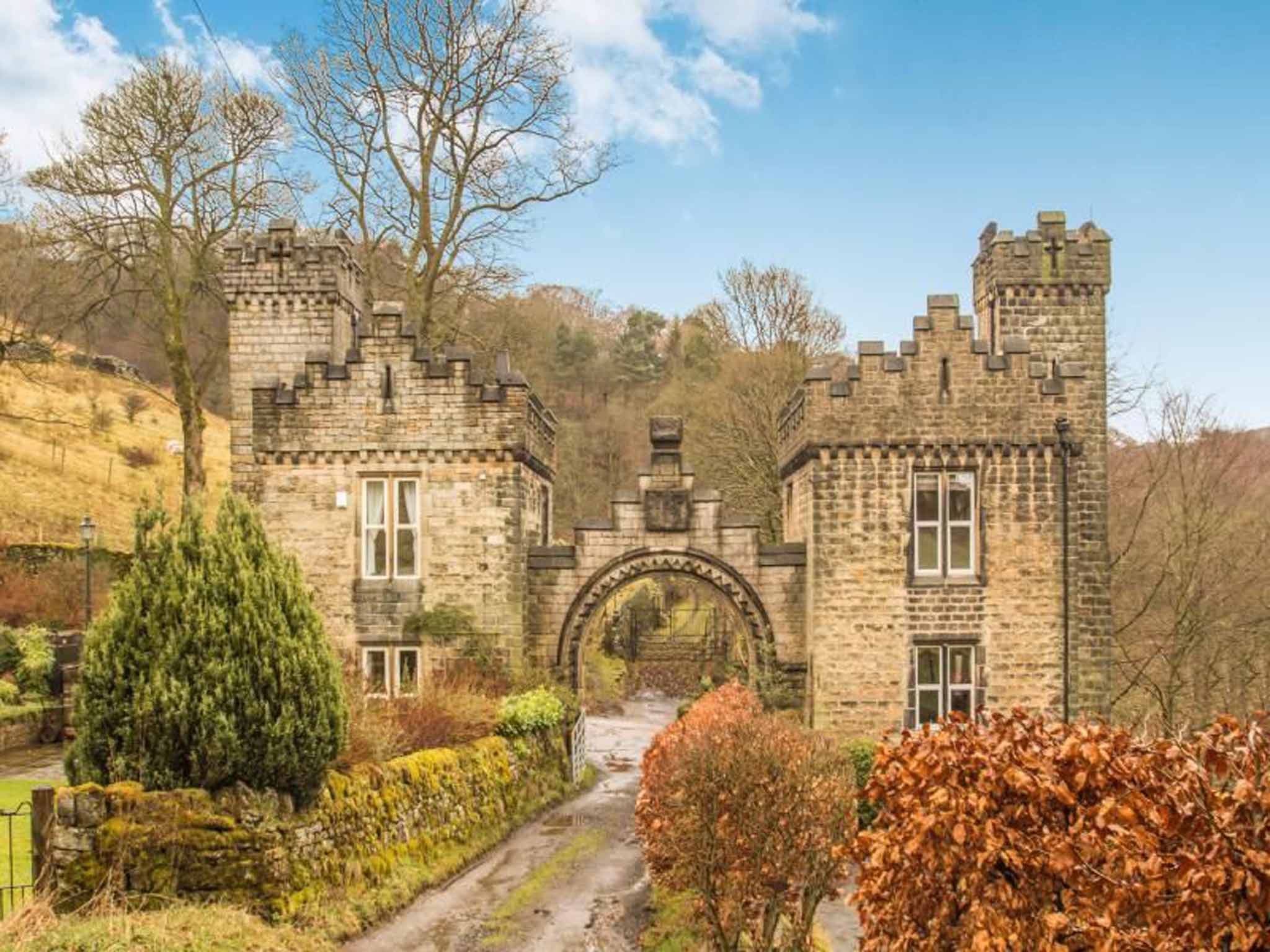 This Grade II listed, three bedroom detached house in Wainstalls, Halifax – once part of the Castle Carr Estate - has a castle-style façade, two and a half acres of land, and marvellous countryside views. On for £375,000 with Reeds Rains.