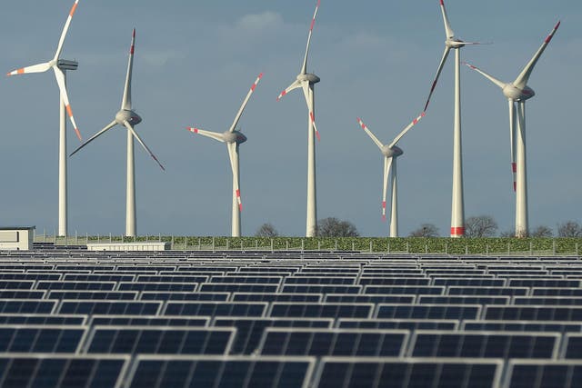 Wind turbines near a solar power plant in Werder, Germany
