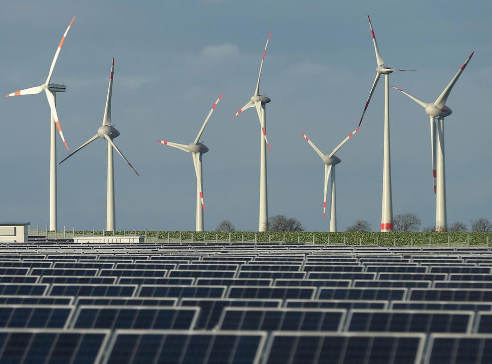 Wind turbines near a solar power plant in Werder, Germany