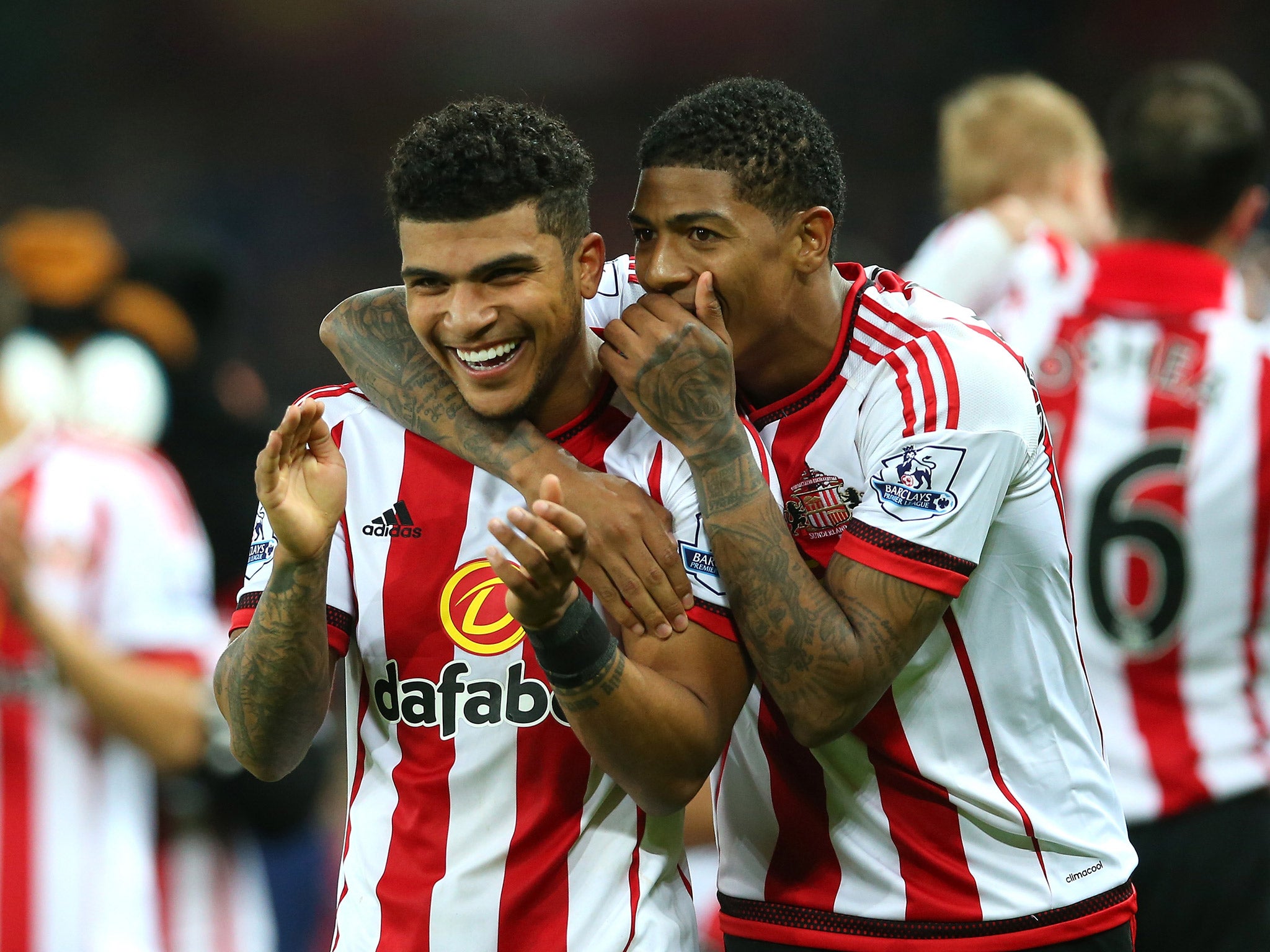 DeAndre Yedlin and Patrick van Aanholt celebrate Sunderland's Premier League survival