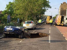 Greenwich sinkhole: Car swallowed by massive hole in London street