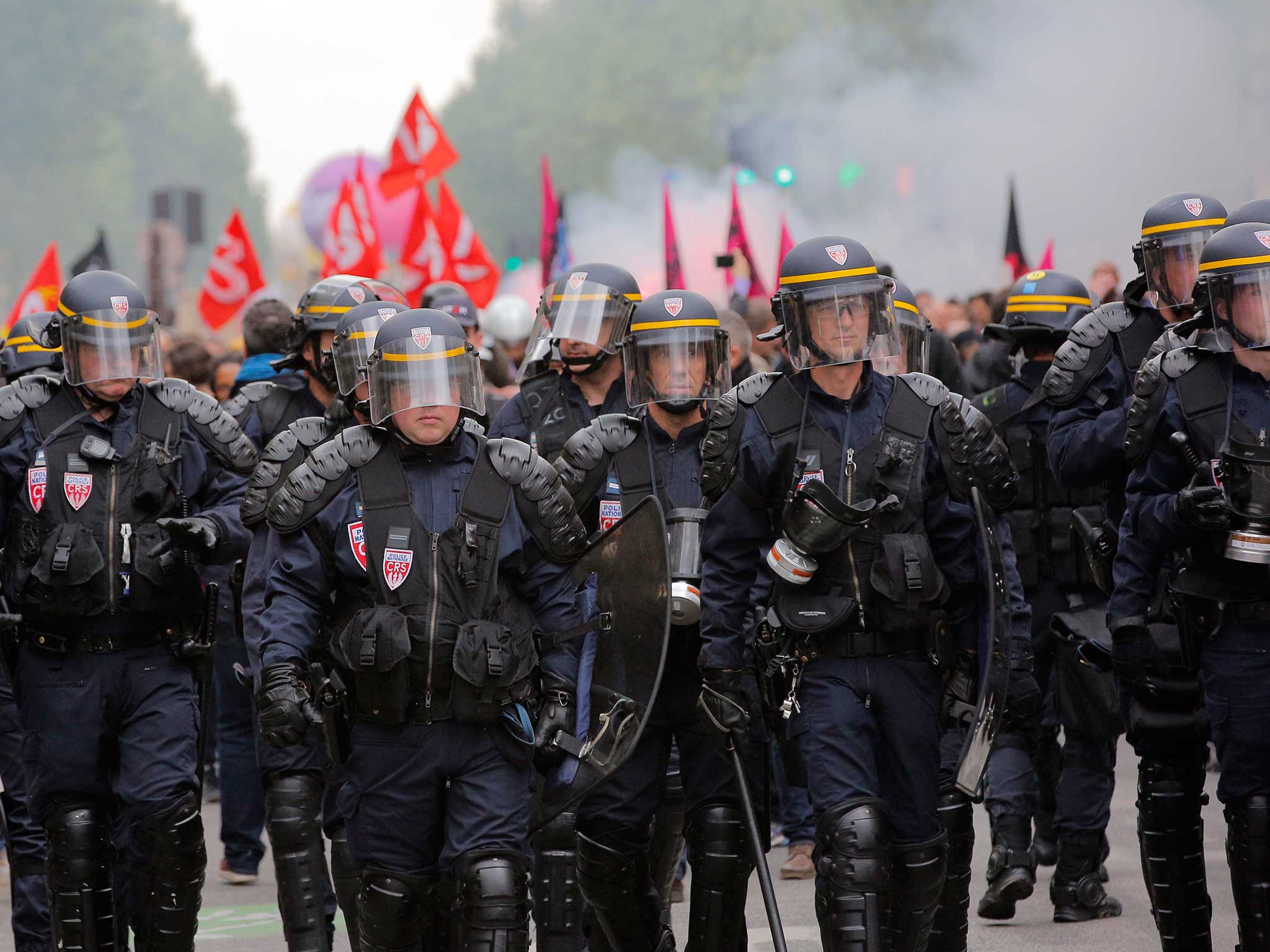 Riot police marched against protesters in the French capital