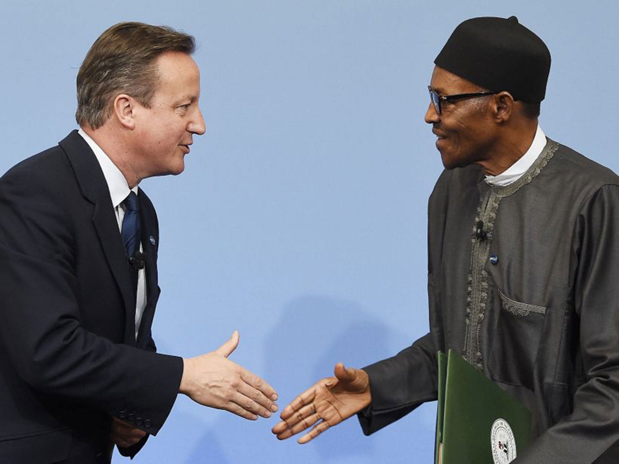The PM greets Nigerian President Muhammadu Buhari at a session of the Anti-Corruption Summit. Earlier this week David Cameron was overheard describing the African nation as 'fantastically corrupt'