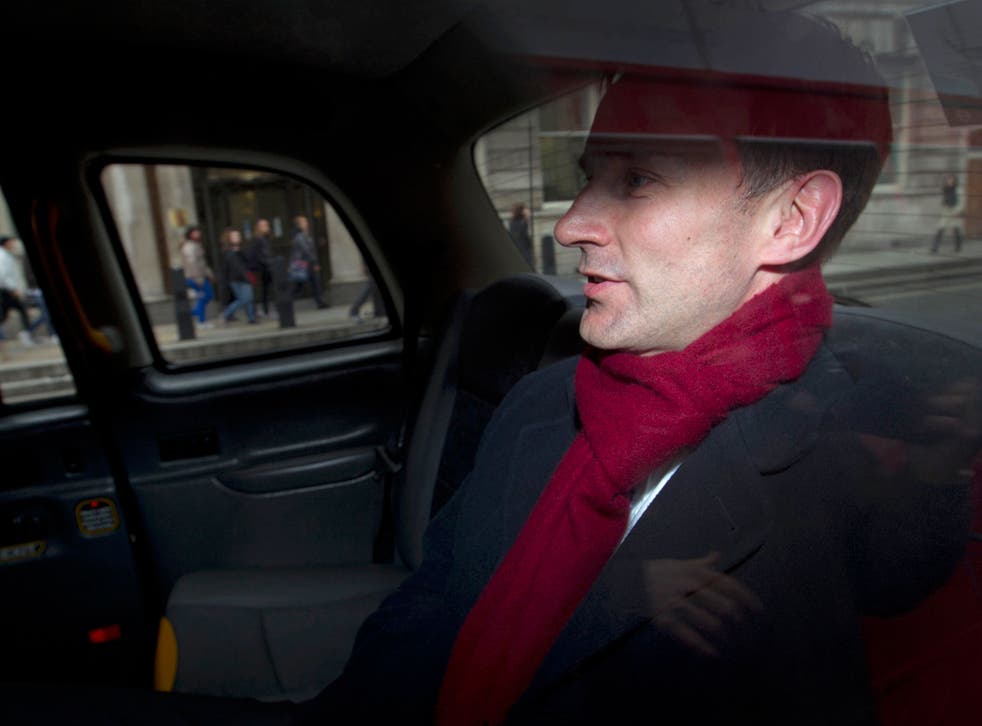 Jeremy Hunt leaves his office in a taxi in April 2012