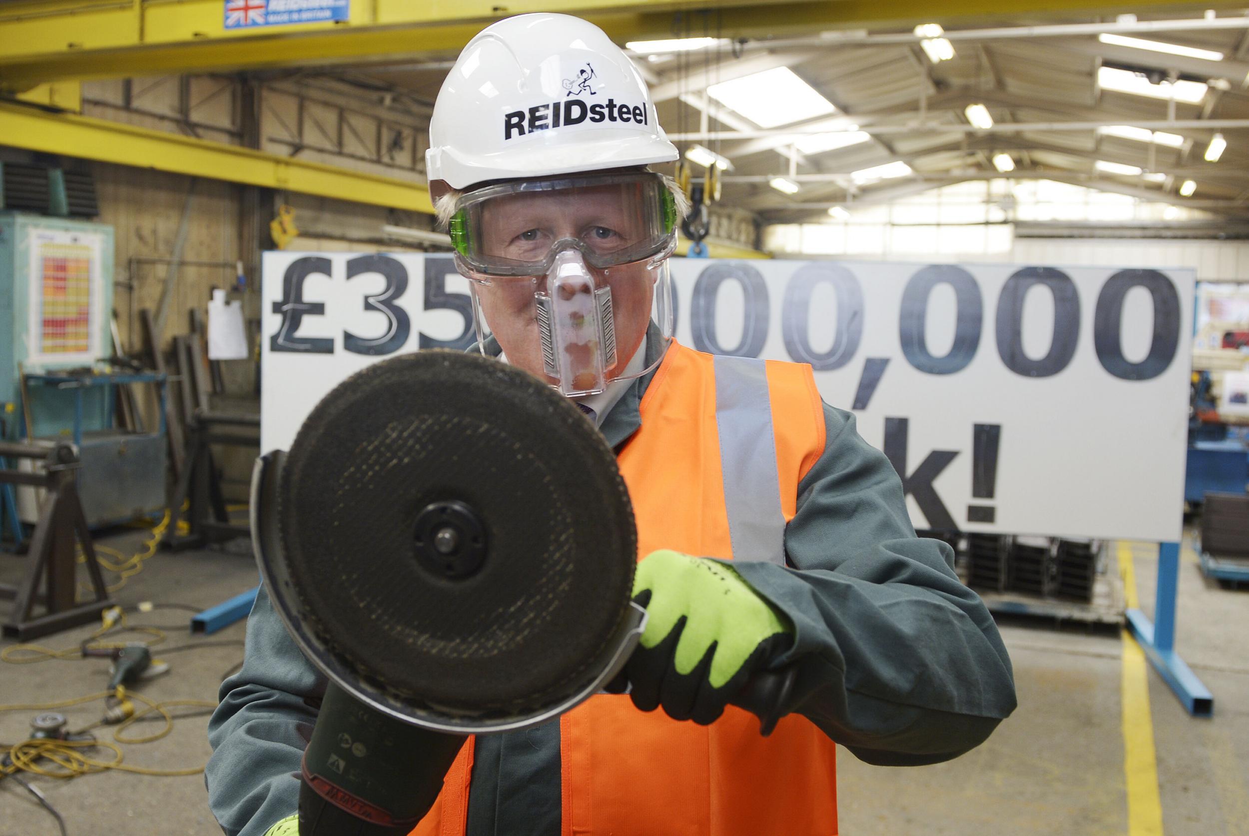 The Etonian Bane: Boris Johnson brandishes an angle grinder at a steel factory in Dorset.
