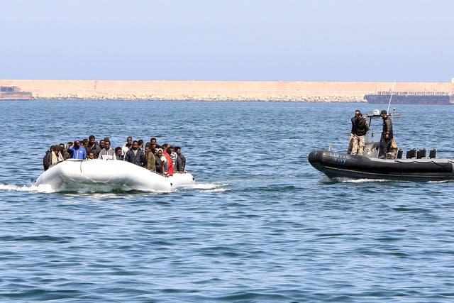 Libyan coast guards chase down a boat of illegal migrants bound for the Italian island of Lampedusa