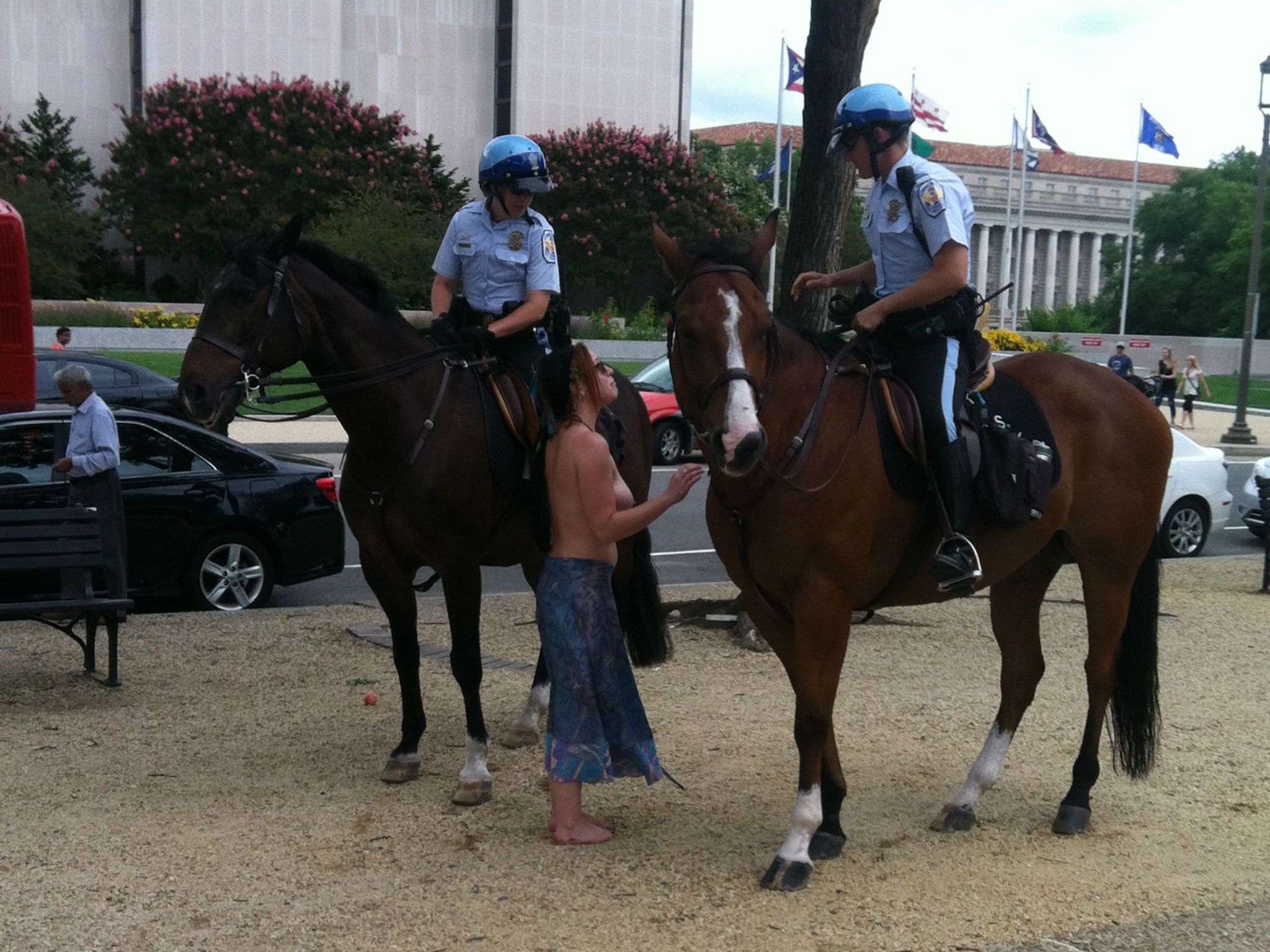 Chelsea Covington speaks to police in Washington DC (Breasts Are Healthy)