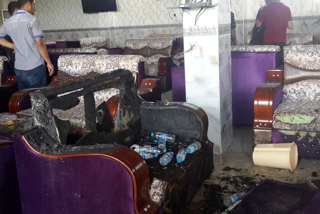 Damage inside a cafe after an attack in the predominately Shia Muslim city of Balad, Iraq, May 13 2016.