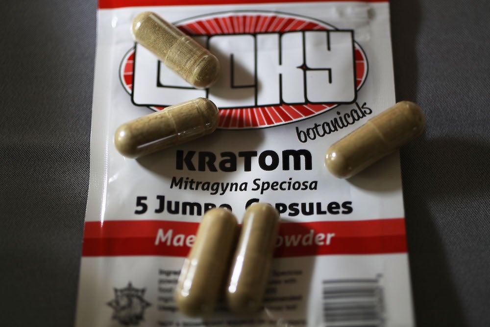 Kratom pills are shown.