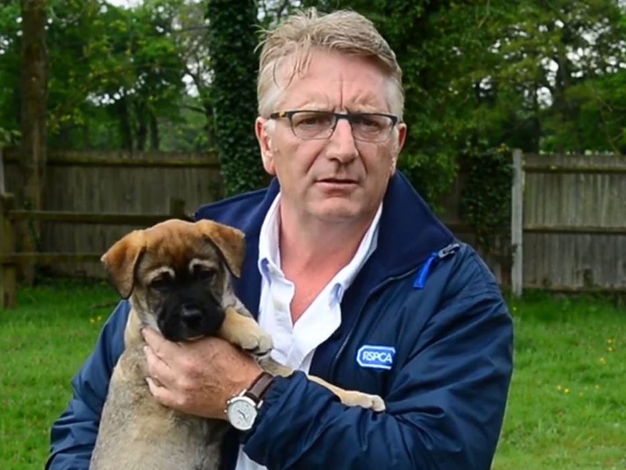 RSPCA boos Jeremy Cooper and a puppy