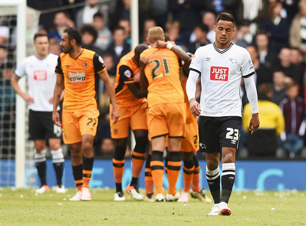 A dejected Tom Ince walks away from Hull City players celebrating their second goal of the game 