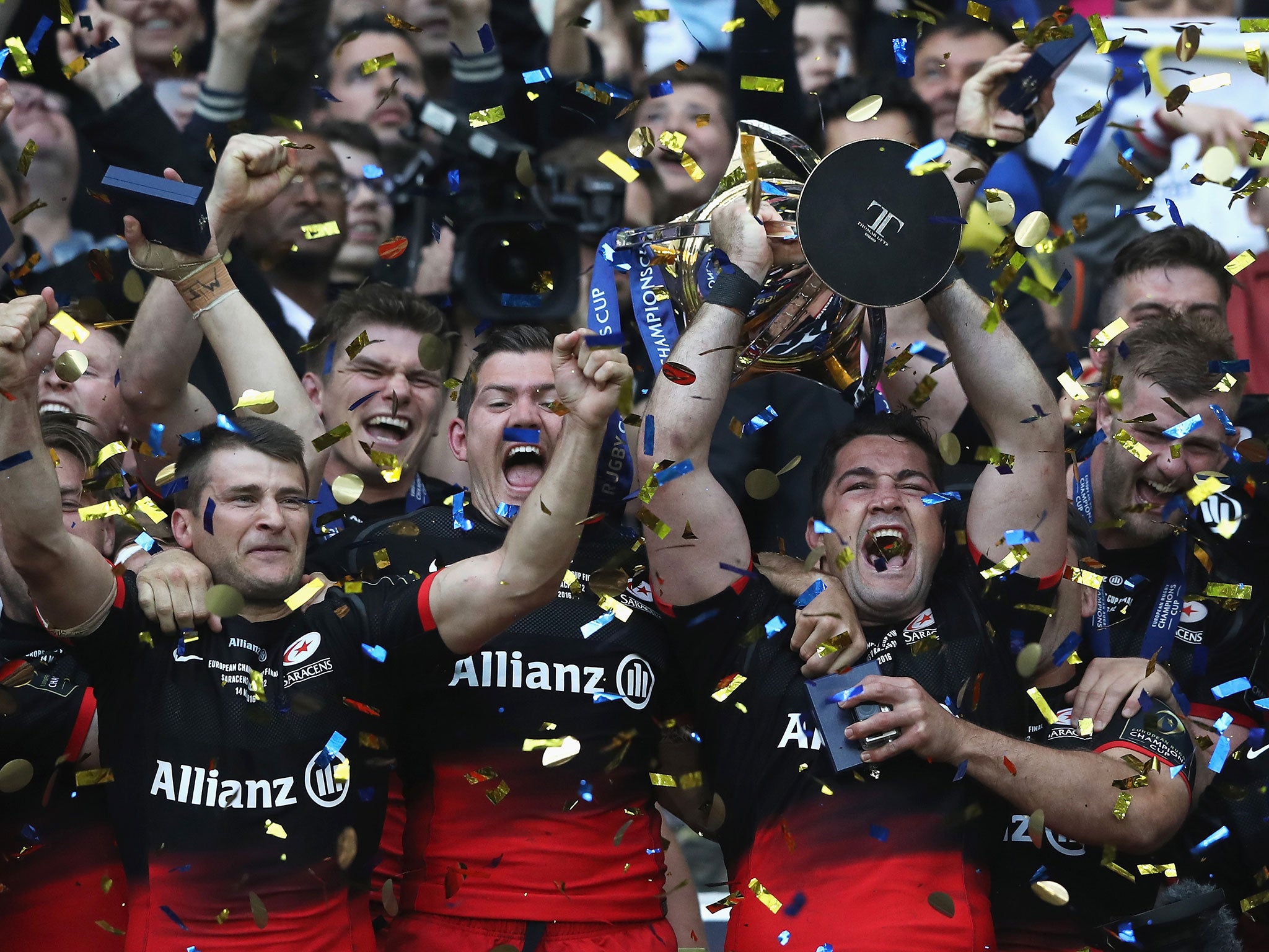 Saracens players left the trophy as they celebrate becoming champions of Europe for the first time