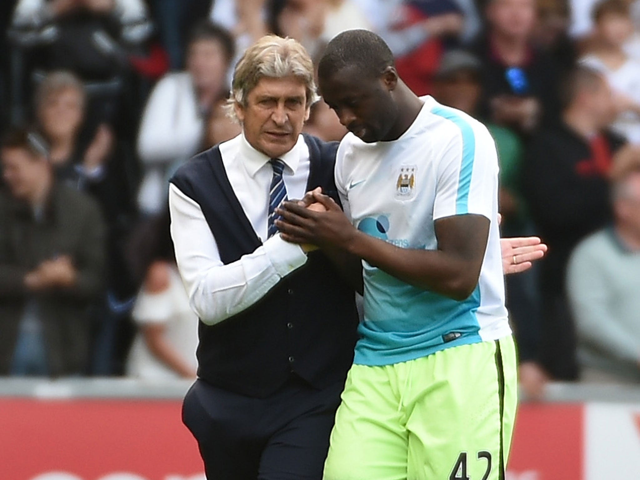 Manuel Pellegrini with Yaya Toure following his final game as Manchester City manager