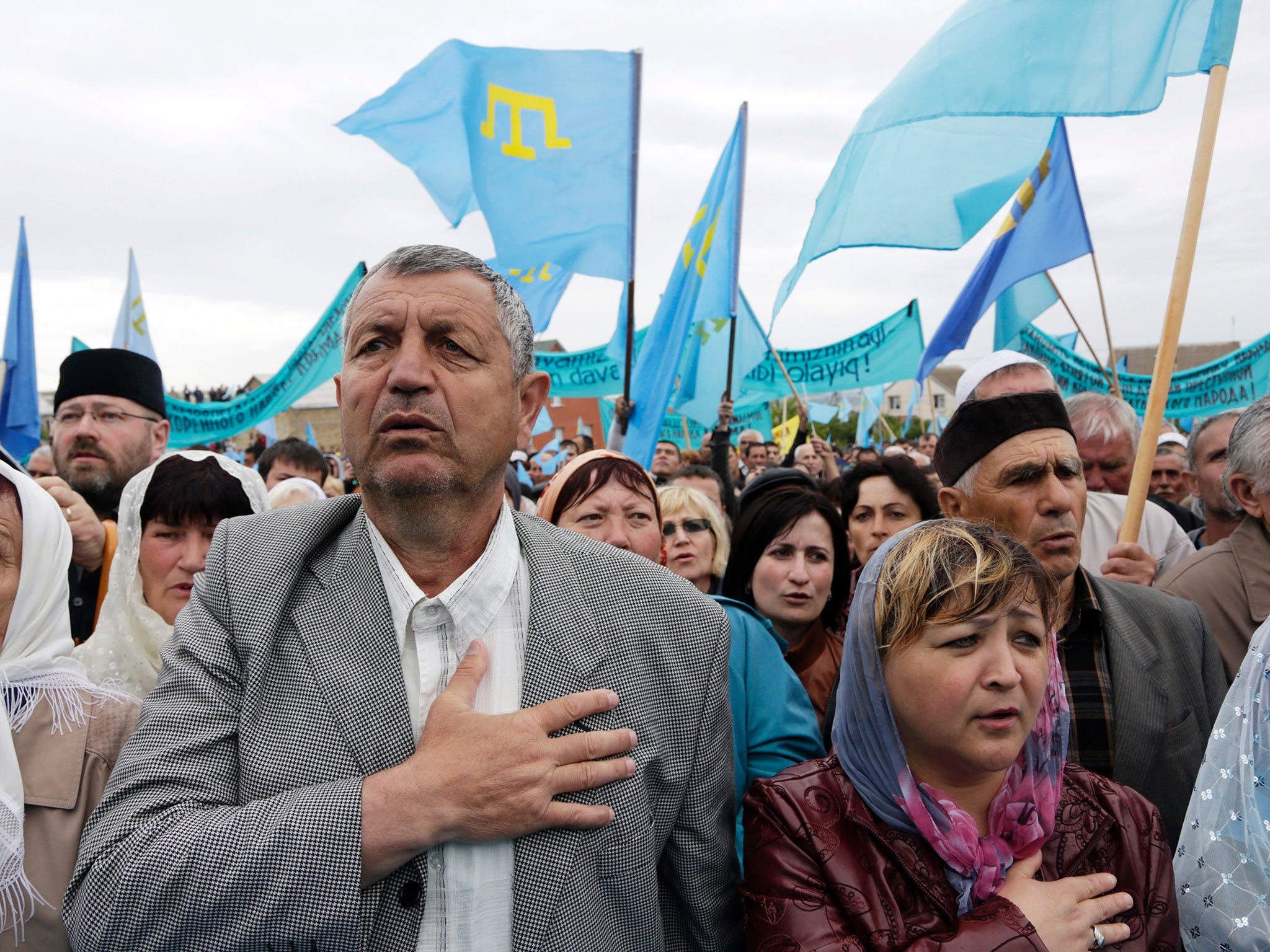 Tatars attend a ceremony in Simferopol in 2014, marking the 70th anniversary of the deportation of Tatars from Crimea