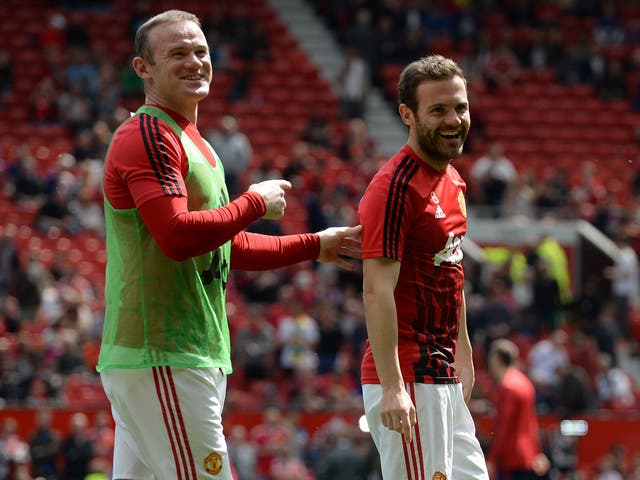 Juan Mata with Wayne Rooney just before the scare at Old Trafford