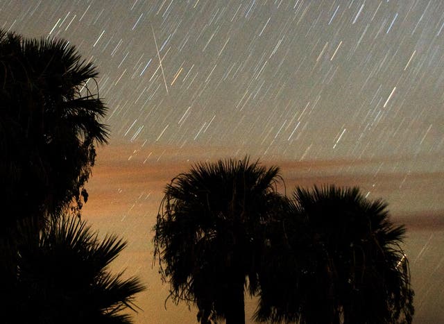 Perseid meteors stream through the sky in a time-lapse photo from Nevada