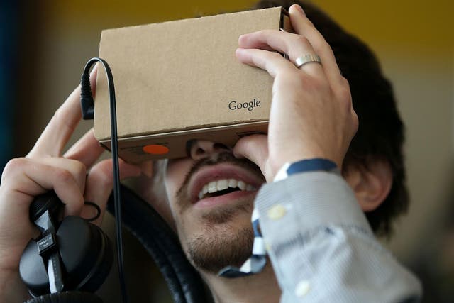A man uses Google's Cardboard VR headset