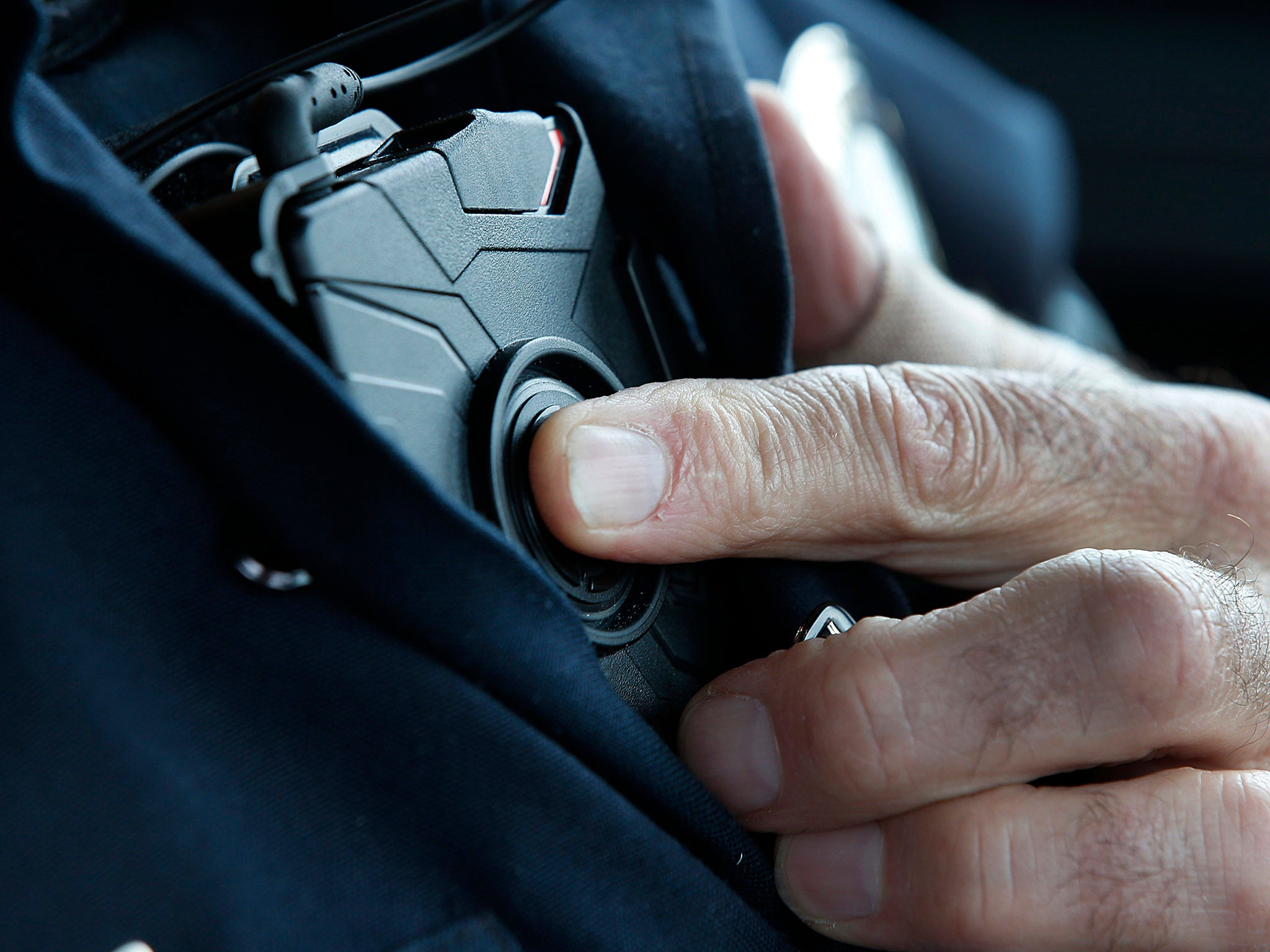 Body cameras make police more vulnerable to attacks - but have no effect on their use of force (file photo)
