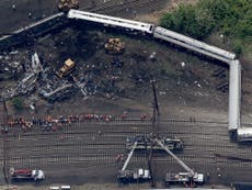 Amtrak engineer 'distracted by radio traffic' before deadly derailment, investigators say