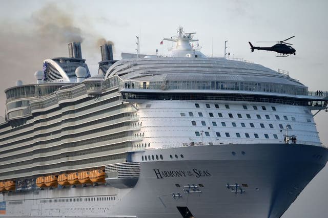 The world's largest passenger ship, MS Harmony of the Seas, owned by Royal Caribbean, makes her way up Southampton Water into Southampton ahead of  her maiden cruise