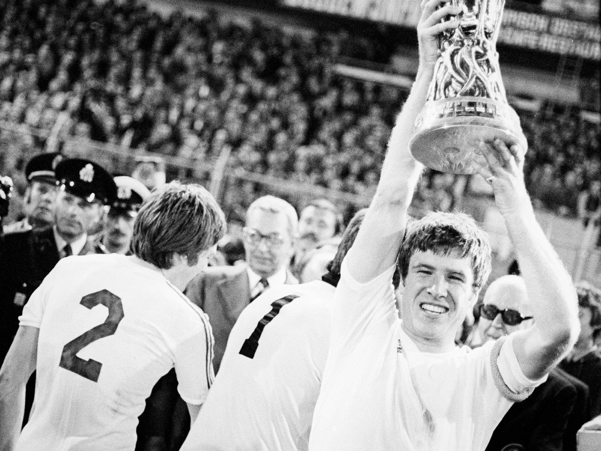 Emlyn Hughes, Liverpool's then-captain, lifts the Uefa Cup in 1976