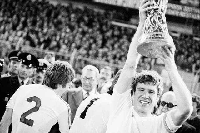 Emlyn Hughes, Liverpool's then-captain, lifts the Uefa Cup in 1976