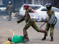 Kenya launches inquiry after police photographed kicking and beating man in crackdown on protests