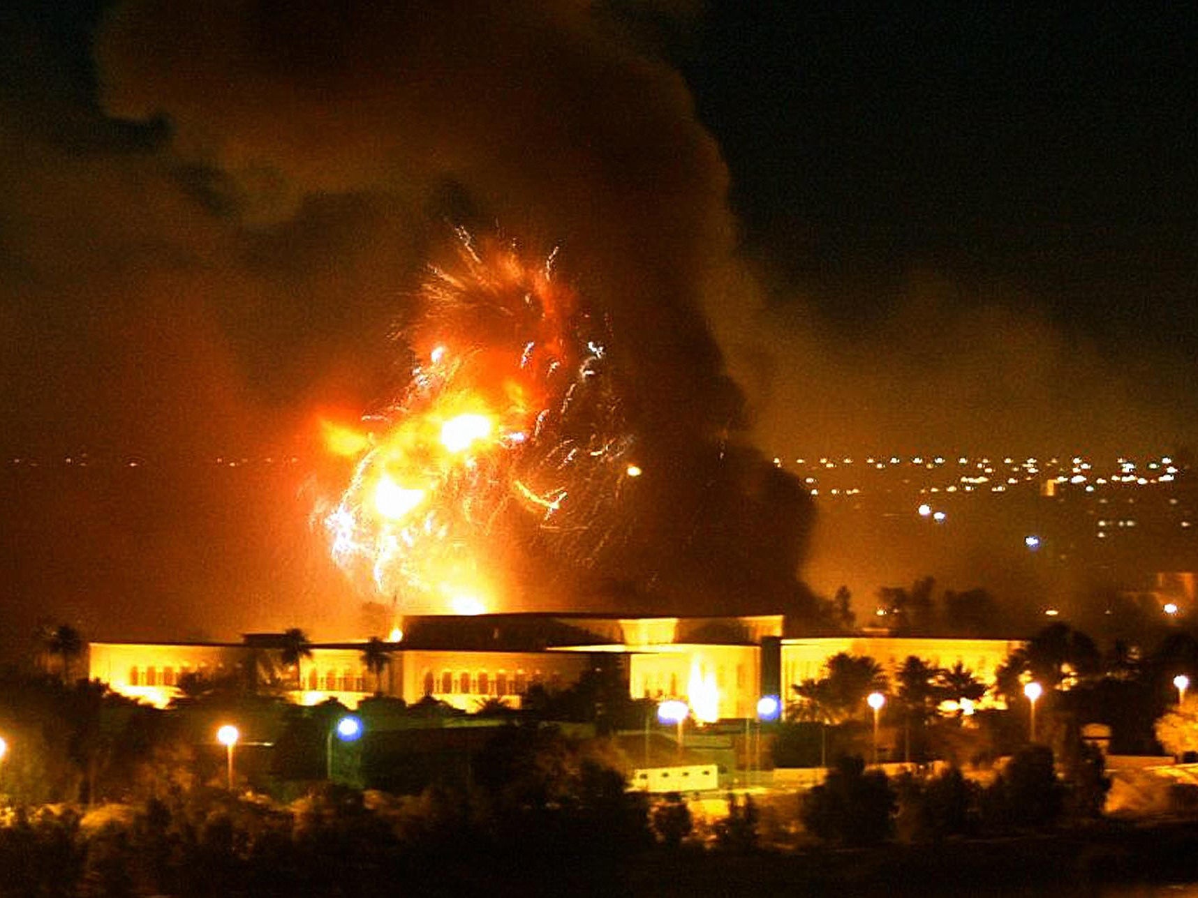 Smoke covers the presidential palace compound during a massive US-led air raid in Baghdad, March 2003