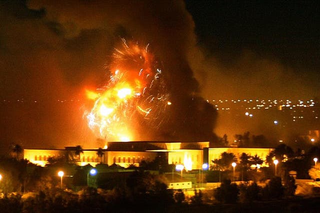 Smoke covers the presidential palace compound during a massive US-led air raid in Baghdad, March 2003