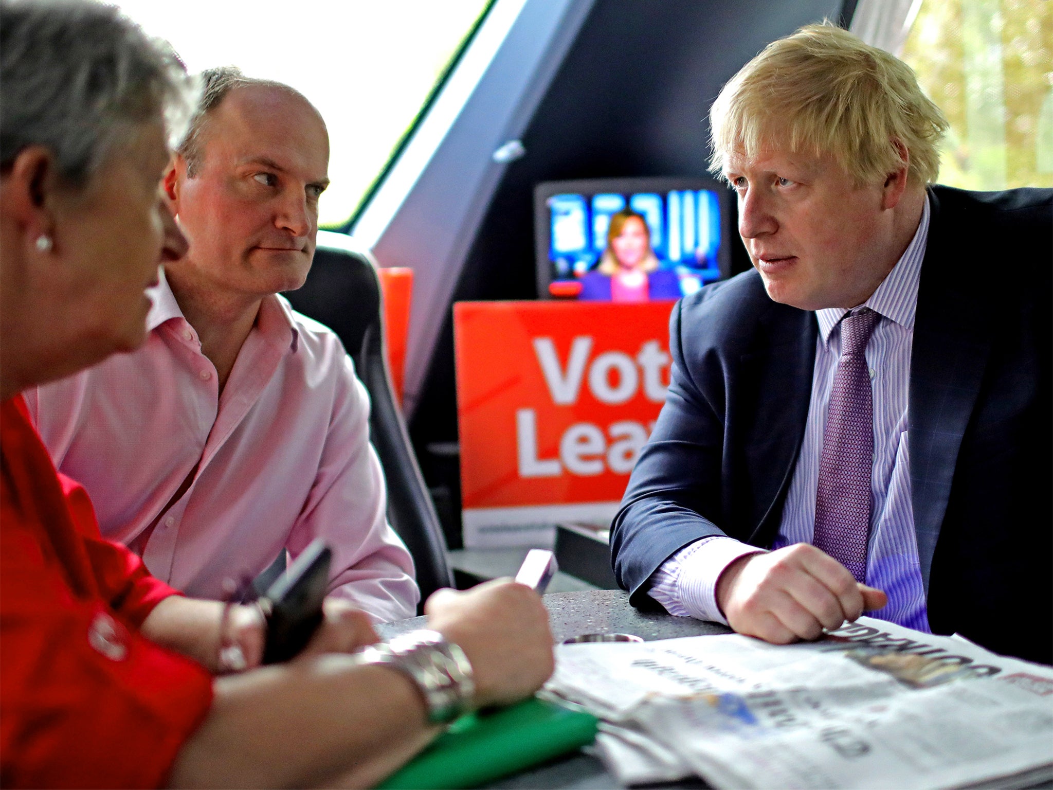 Boris Johnson talks with Labour MP Gisela Stuart and Ukip's Douglas Carswell aboard the Vote Leave Battle Bus yesterday