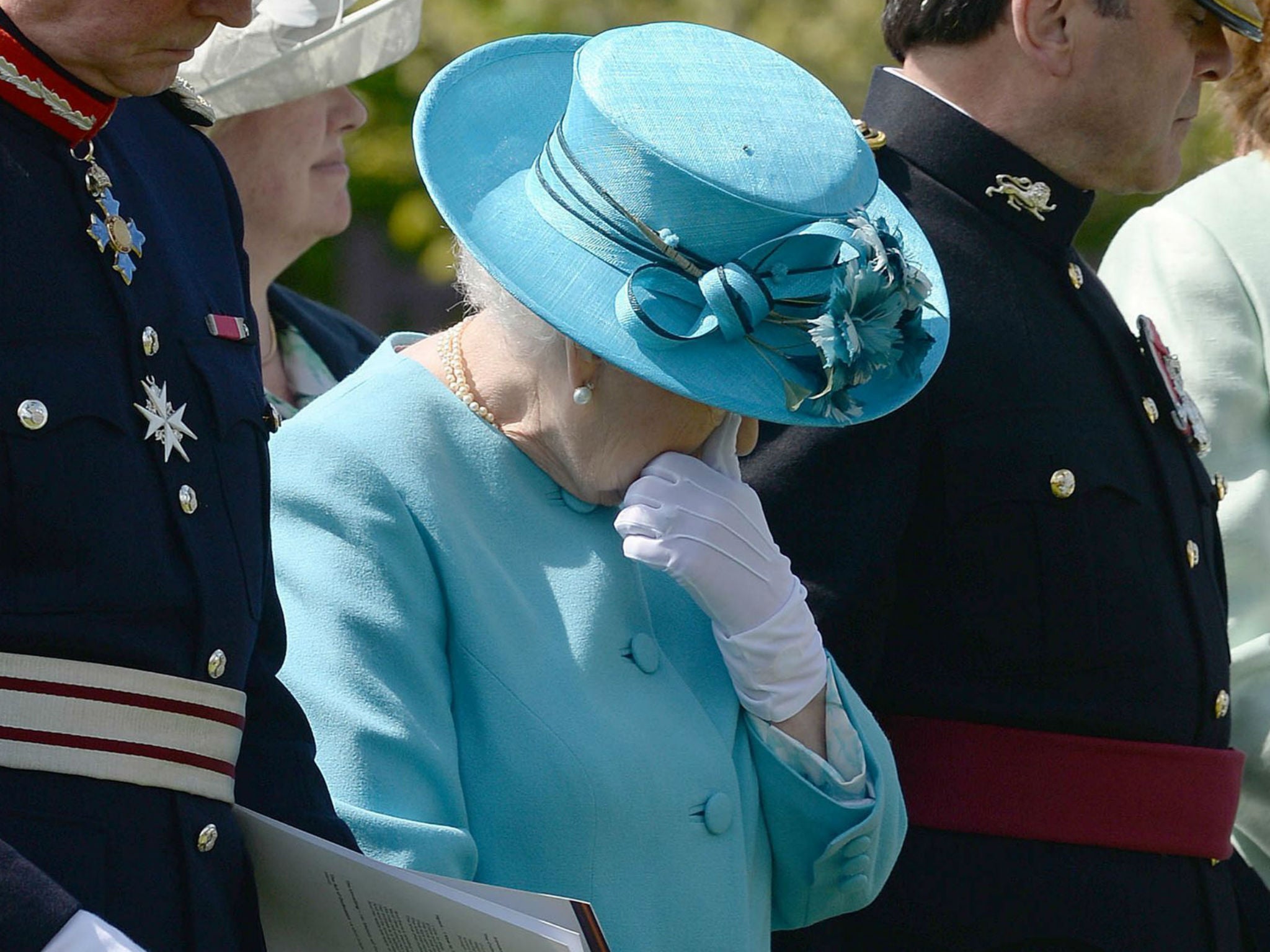 Queen Elizabeth II wipes her eye during the service in a tribute to soldiers from the Duke of Lancaster's Regiment killed while serving in Afghanistan