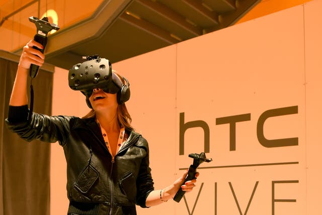 A woman uses the HTC Vive in New York in October 2015