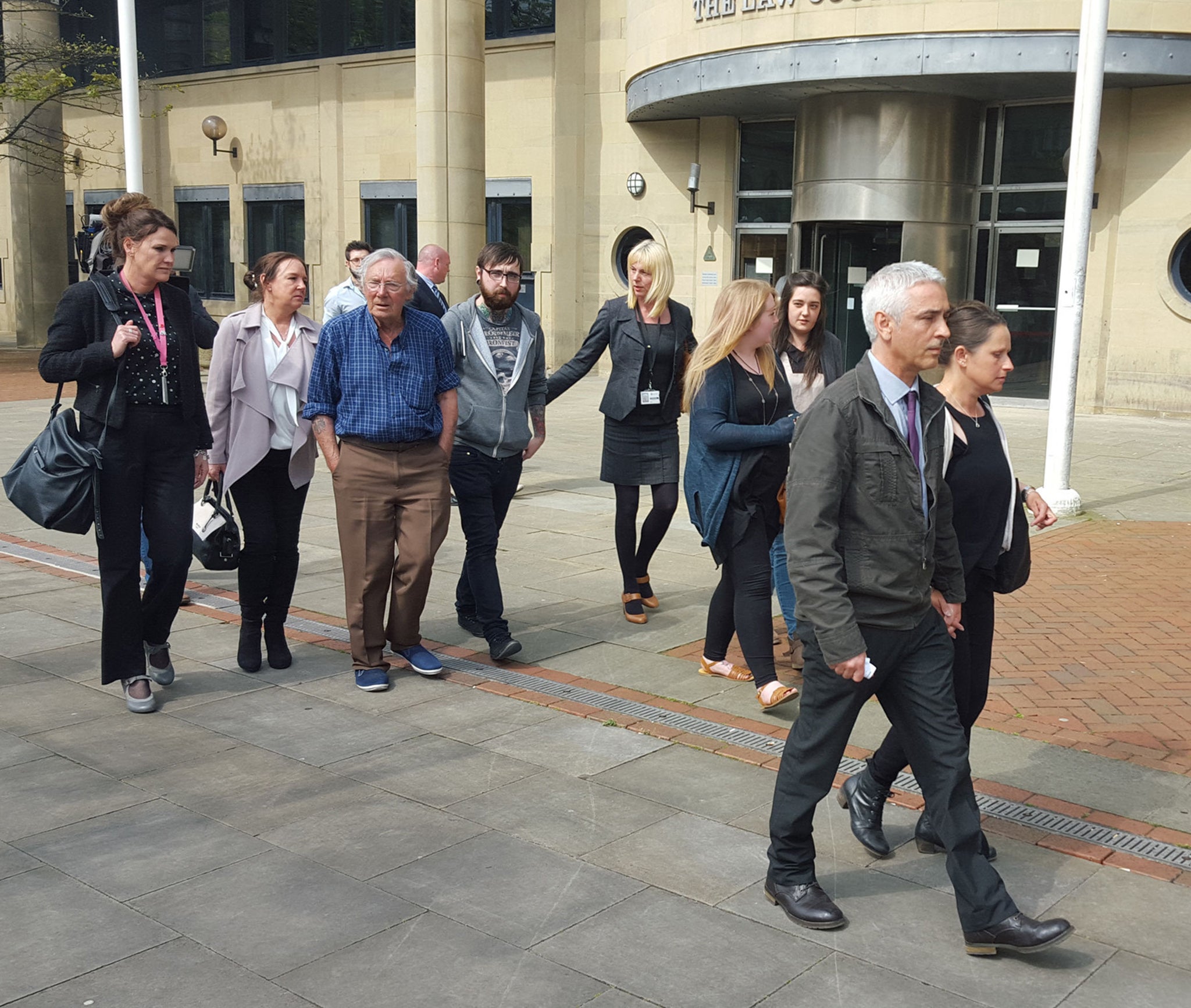 Peter Weaver (front right), the grandfather of 17-month-old Jasmine Weaver and three-year-old Evelyn Lupidi leaves Bradford Crown Court with family members