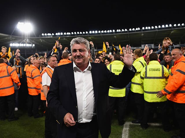 Hull City manager Steve Bruce takes the acclaim of supporters after guiding his side to next week's play-off final at Wembley (Getty)