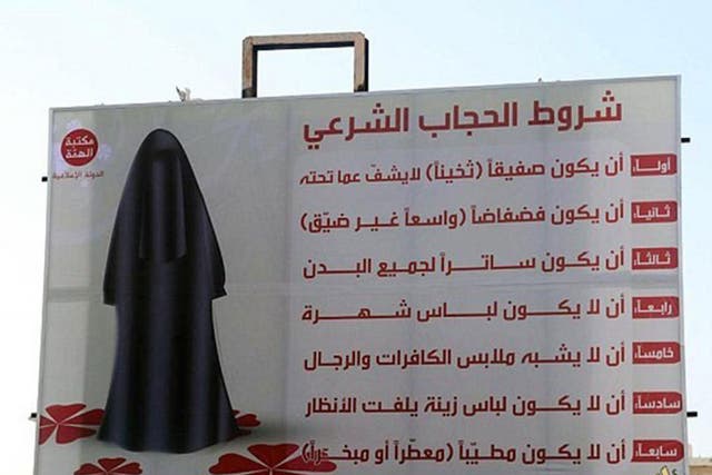 A billboard in Sirte outlines rules for women's clothing