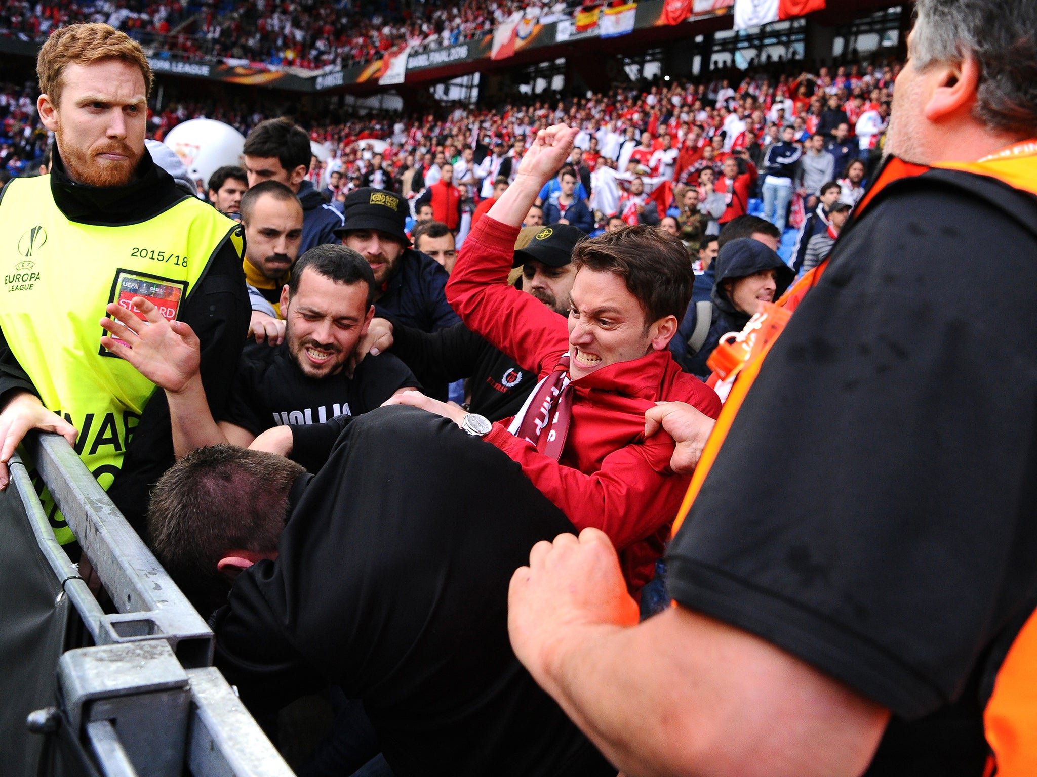 Fans scuffle prior to the UEFA Europa League Final match between Liverpool and Sevilla at St. Jakob-Park